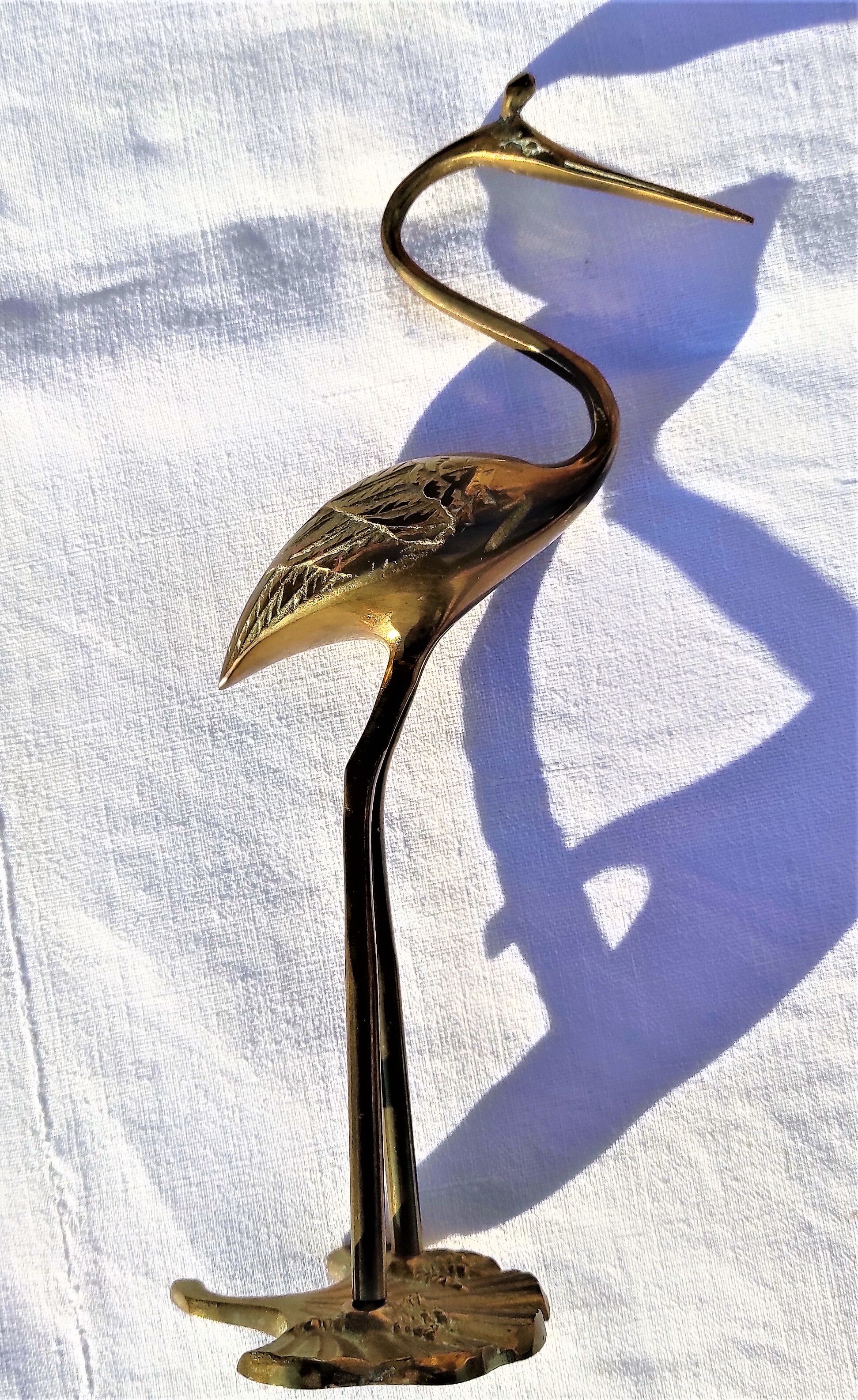 Heron or brass wading bird around the 1960s/1970s