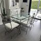 Roche Bobois glass and steel dining table and 6 chairs