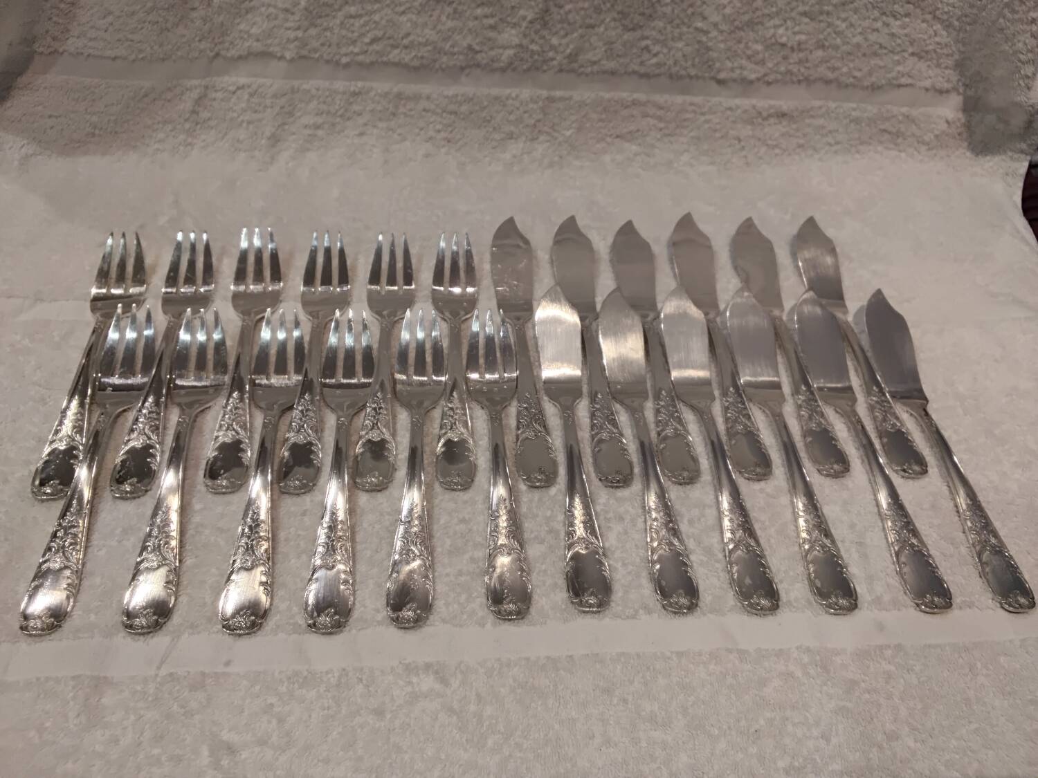 12 forks, 12 fish knives, silver-plated metal, rocaille pattern