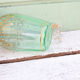 Green and gold flask numbered 23
