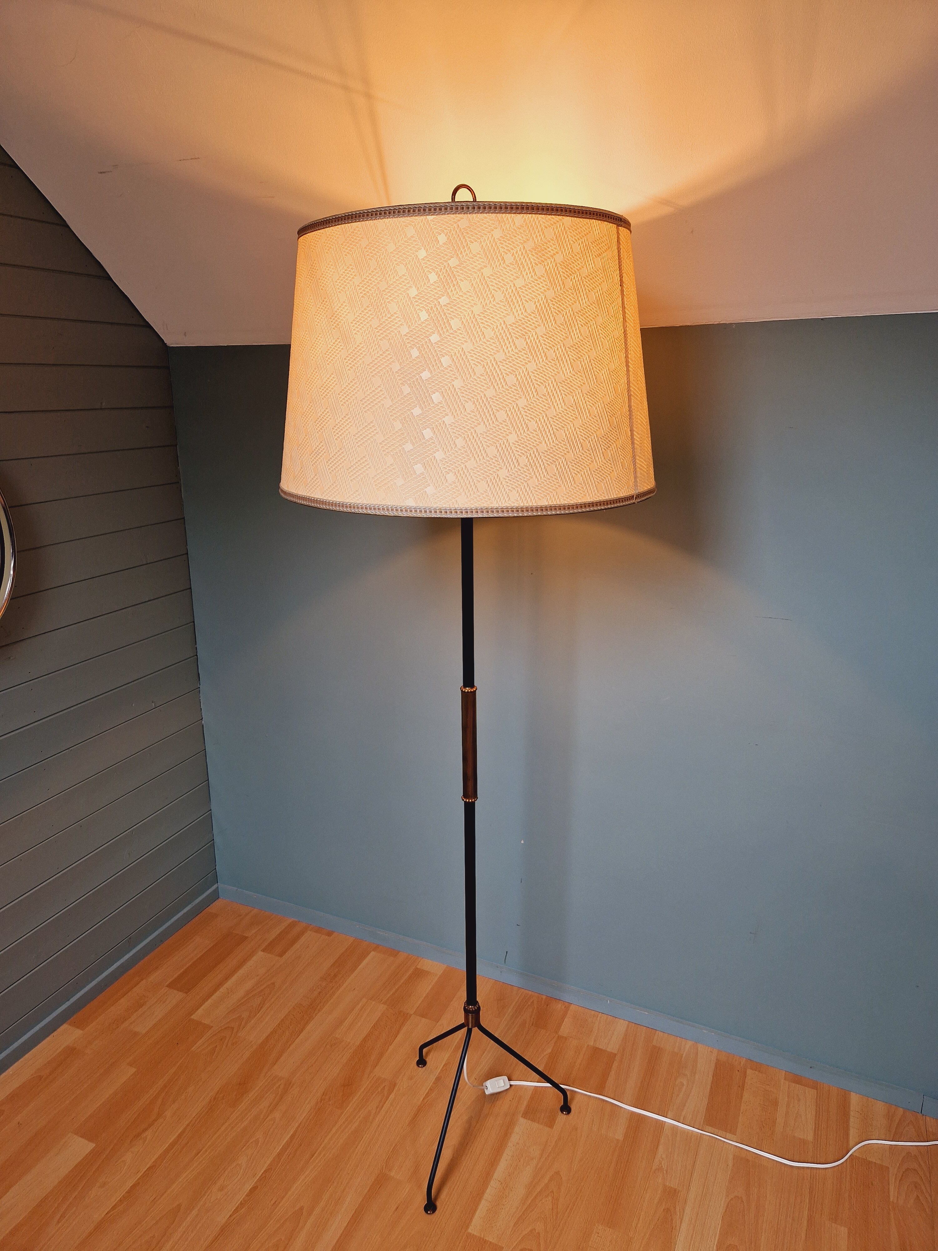 Vintage tripod floor lamp in black lacquered metal and brass, 50s