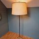 Vintage tripod floor lamp in black lacquered metal and brass, 50s