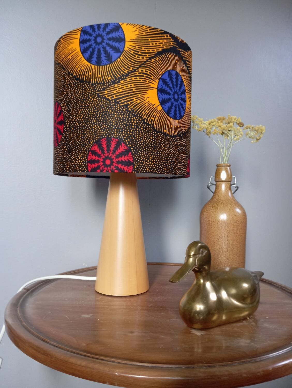 Table lamp in blond wood with handmade wax shade