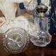 Pair of antique Louis XVI style bottles in finely engraved crystal and silver.