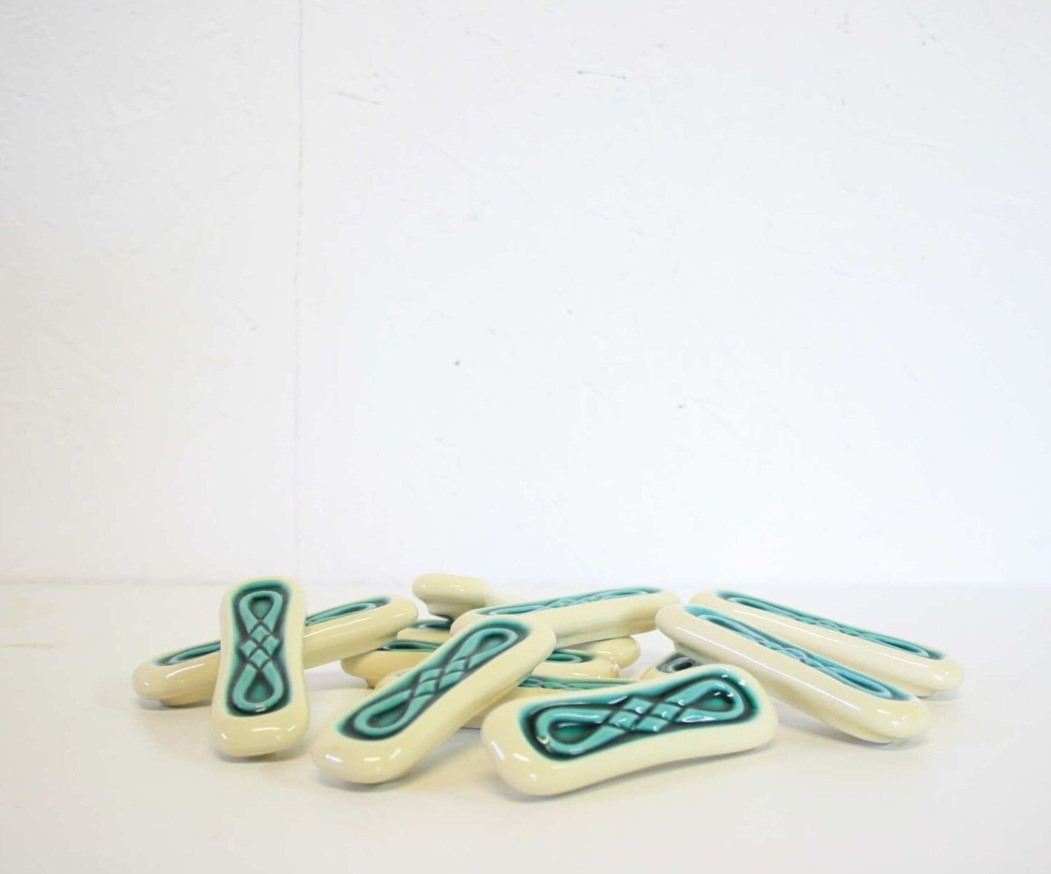 Set of twelve turquoise ceramic knife holders