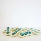 Set of twelve turquoise ceramic knife holders
