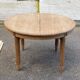 Renovated round Art Deco dining table, extendable, made of solid oak, 213cm.