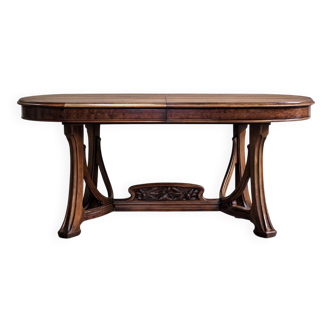 According to Gauthier-Poinsignon: Art Nouveau extendable table in walnut.