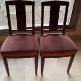 Set of 2 wooden chairs with padded seats.