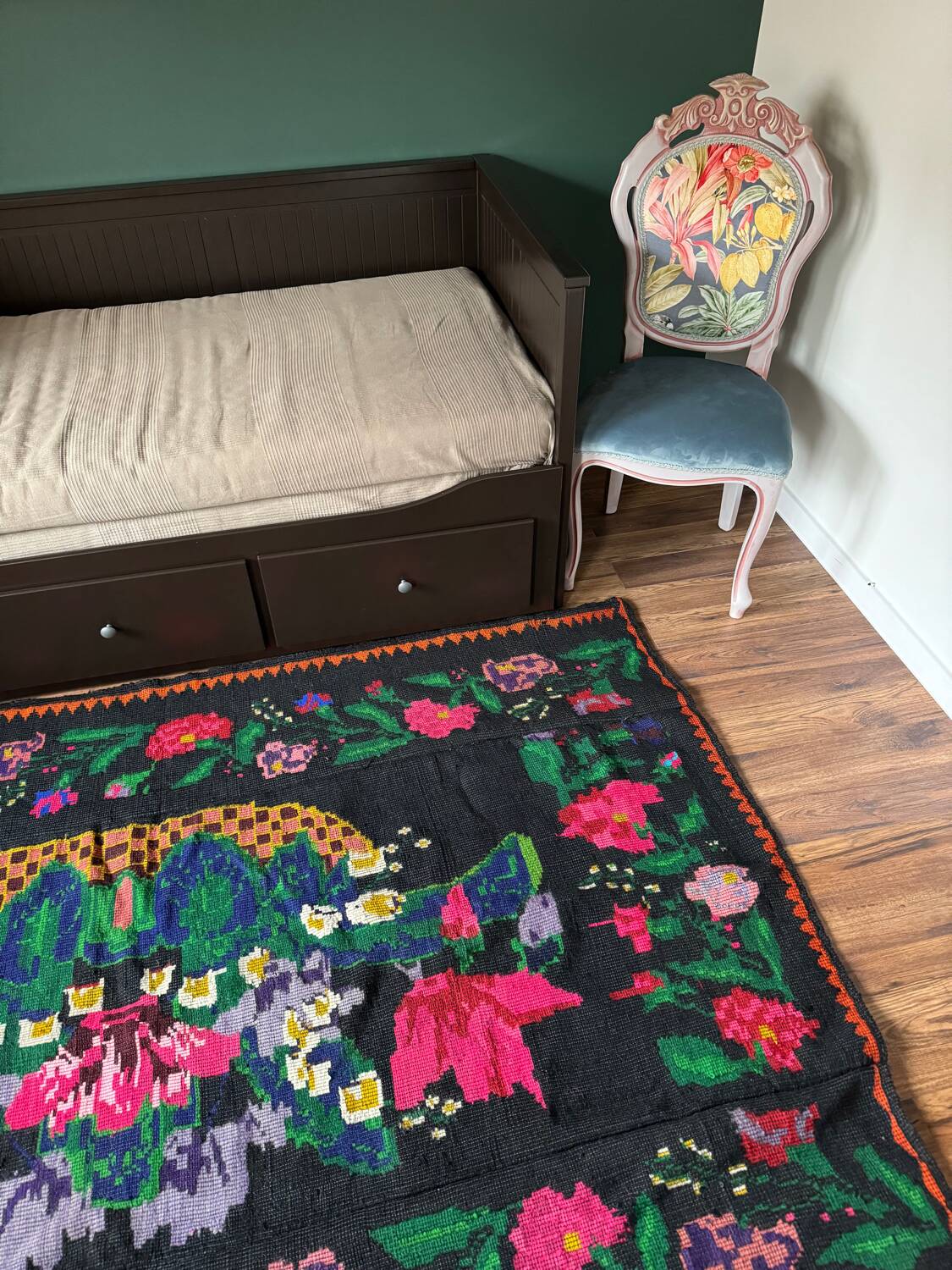 Romanian black wool carpet with a basket of colorful flowers