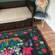 Romanian black wool carpet with a basket of colorful flowers
