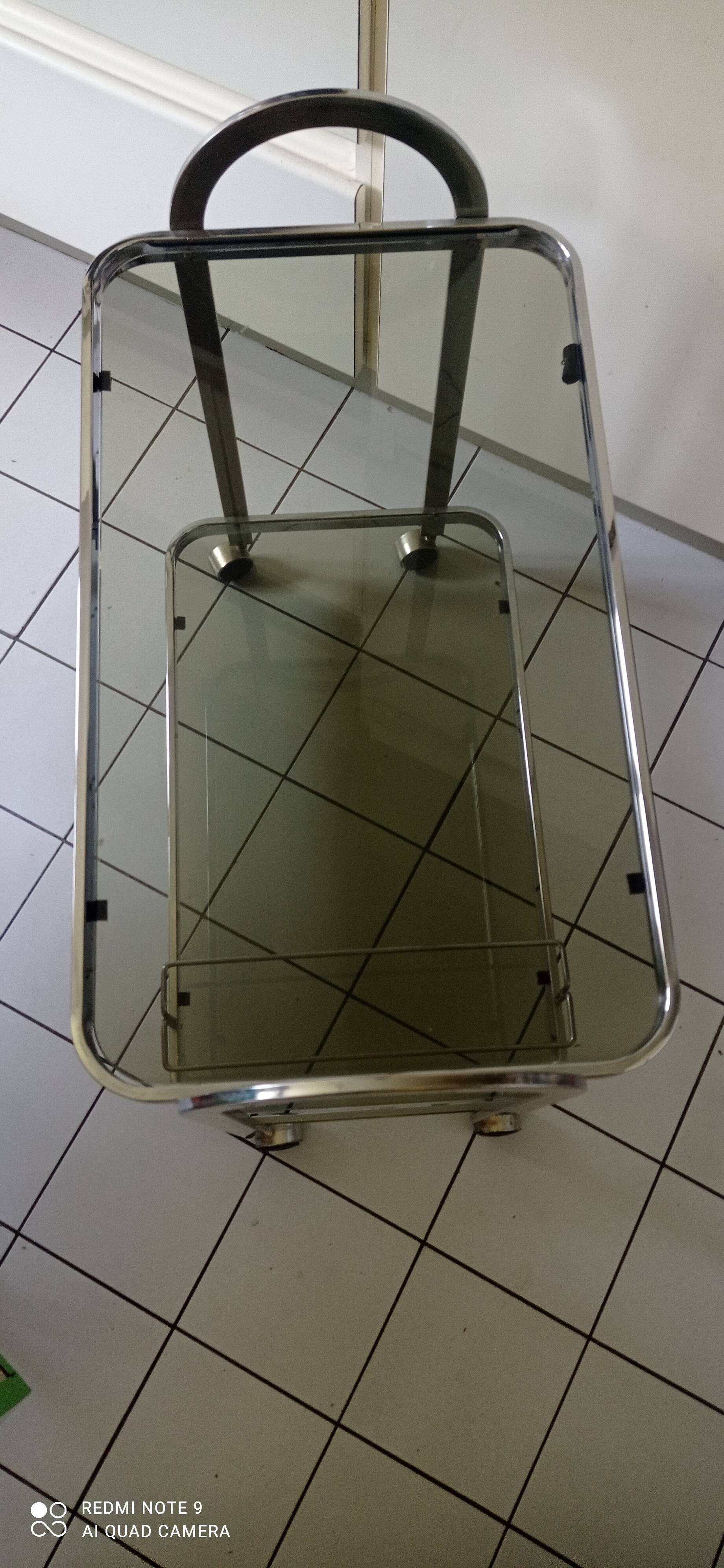 Vintage rolling trolley in smoked glass