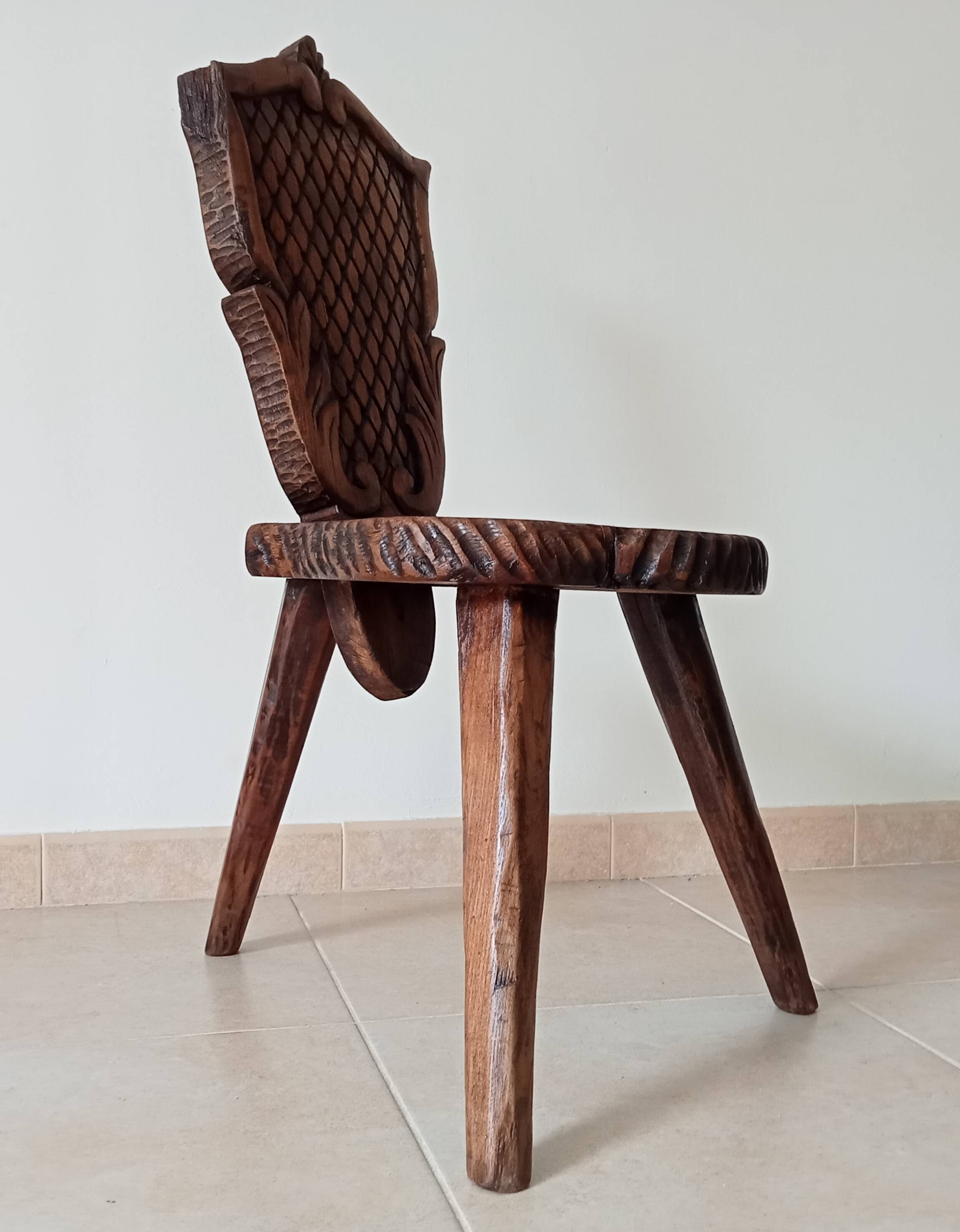Brutalist tripod chair in carved wood 19th century