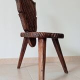 Brutalist tripod chair in carved wood 19th century