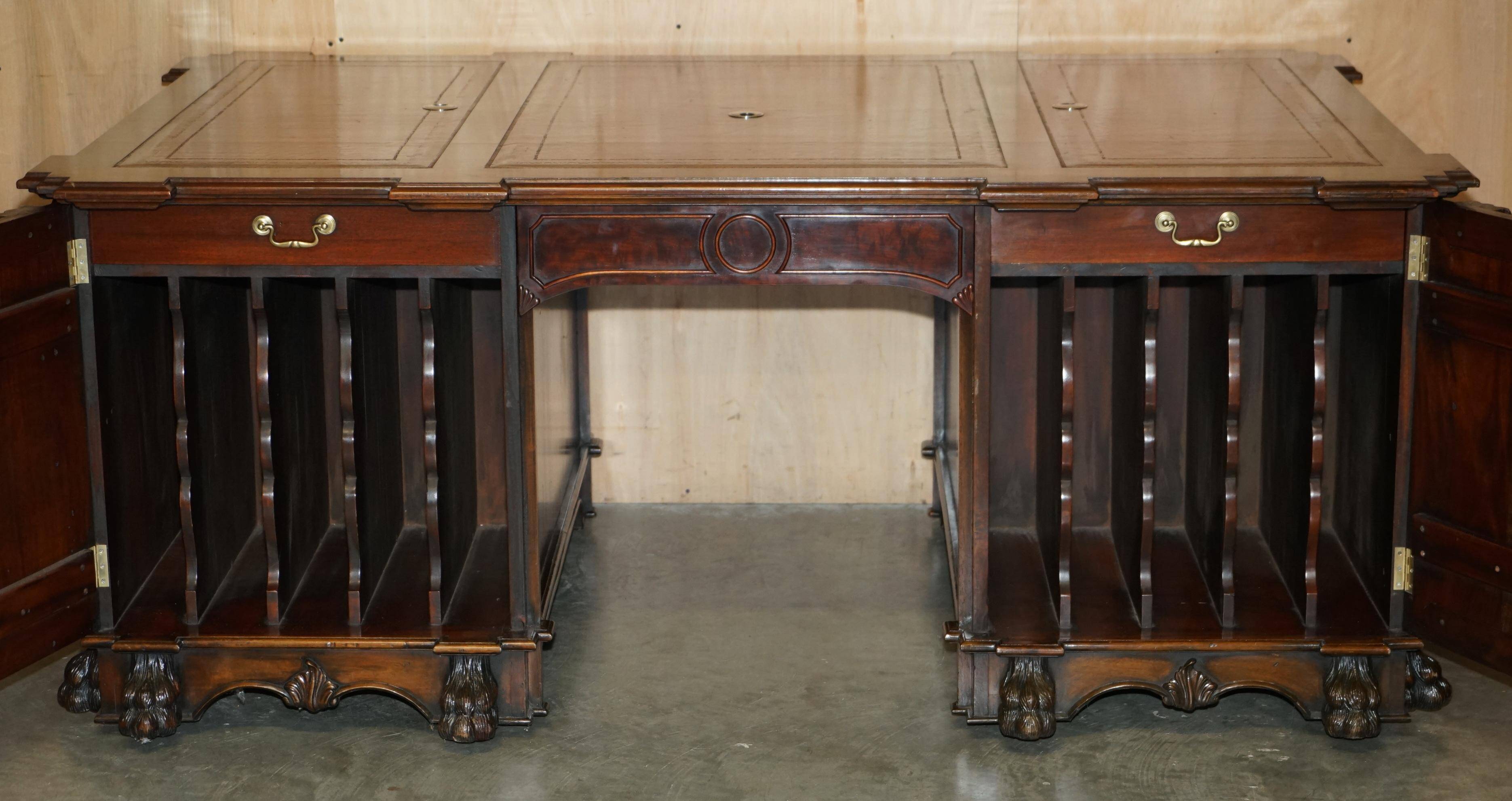 Partner desk with two carved columns featuring lion heads, according to Thomas Chippendale, restored.