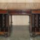 Partner desk with two carved columns featuring lion heads, according to Thomas Chippendale, restored.