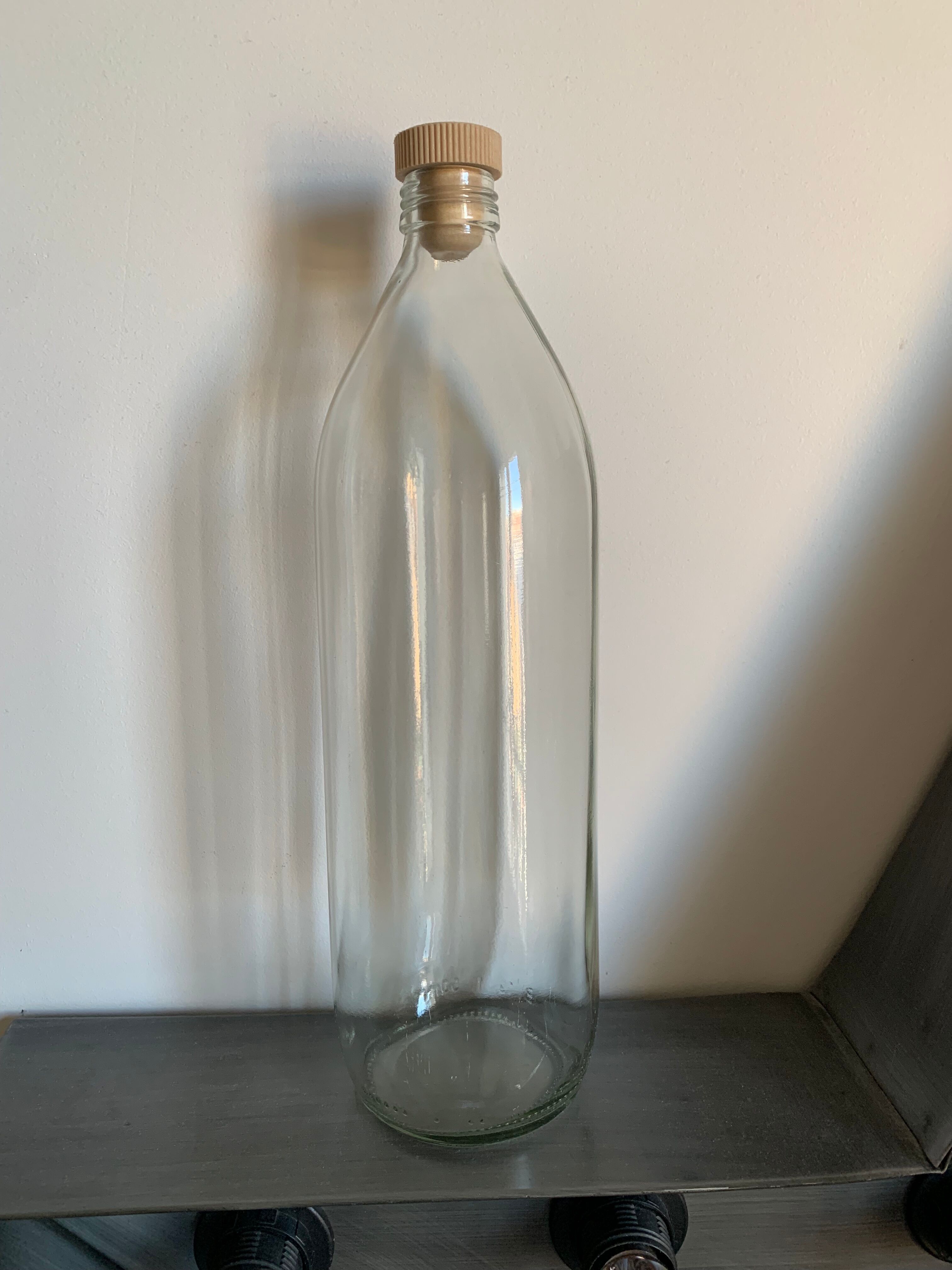 Antique glass bottle with a capacity of 1 litre and its beige cap - in very good condition!