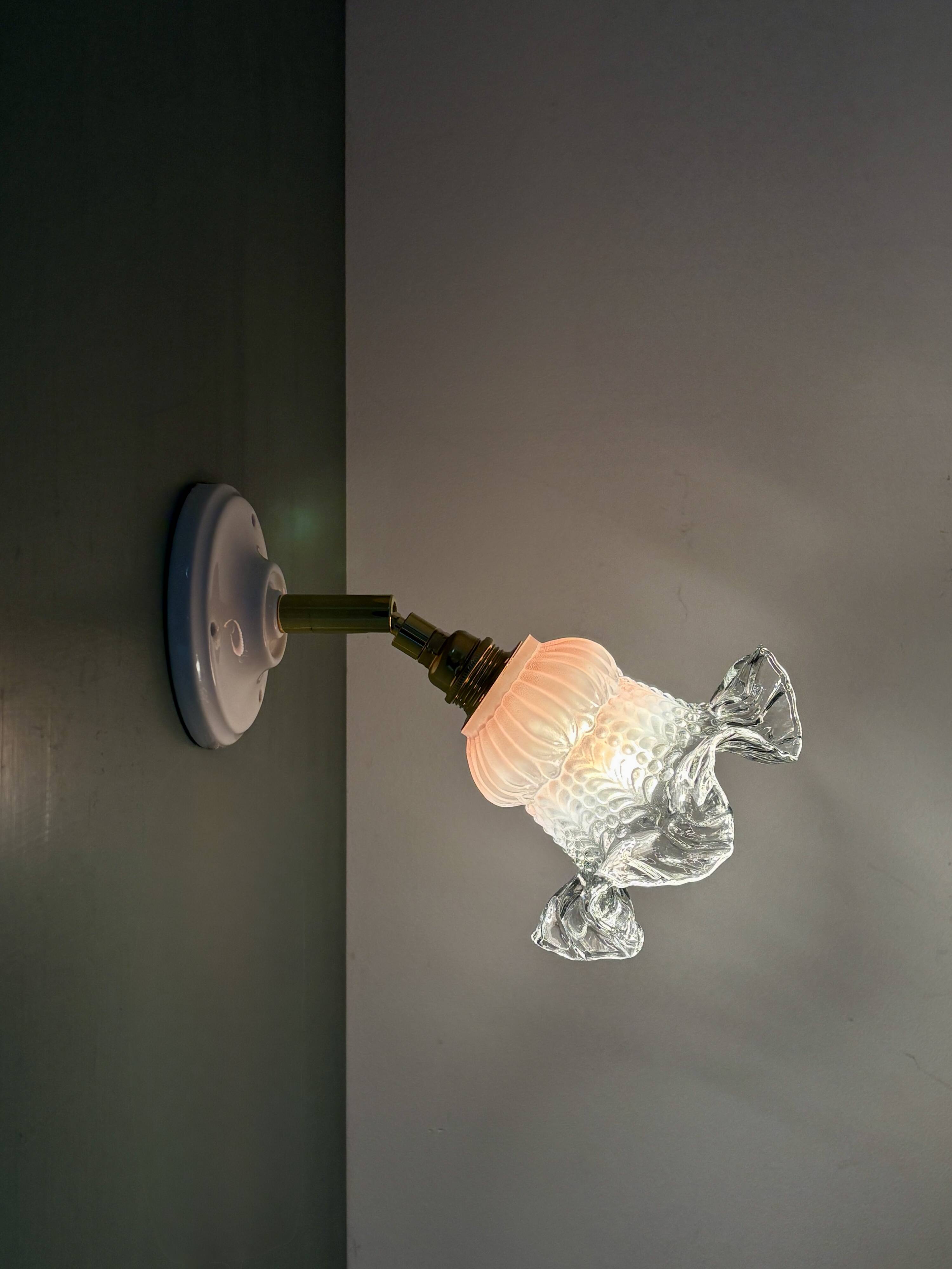 Vintage pink and clear glass tulip wall light.