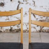 Pair of Scandinavian chairs in teak and faux leather, 1960.
