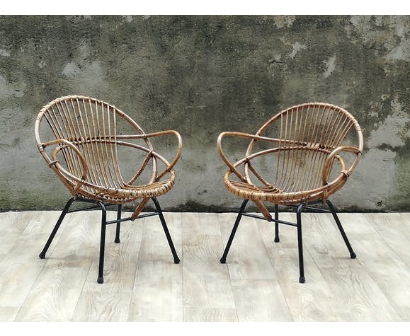 Pair of rattan shell chairs with metallic feet