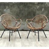 Pair of rattan shell chairs with metallic feet