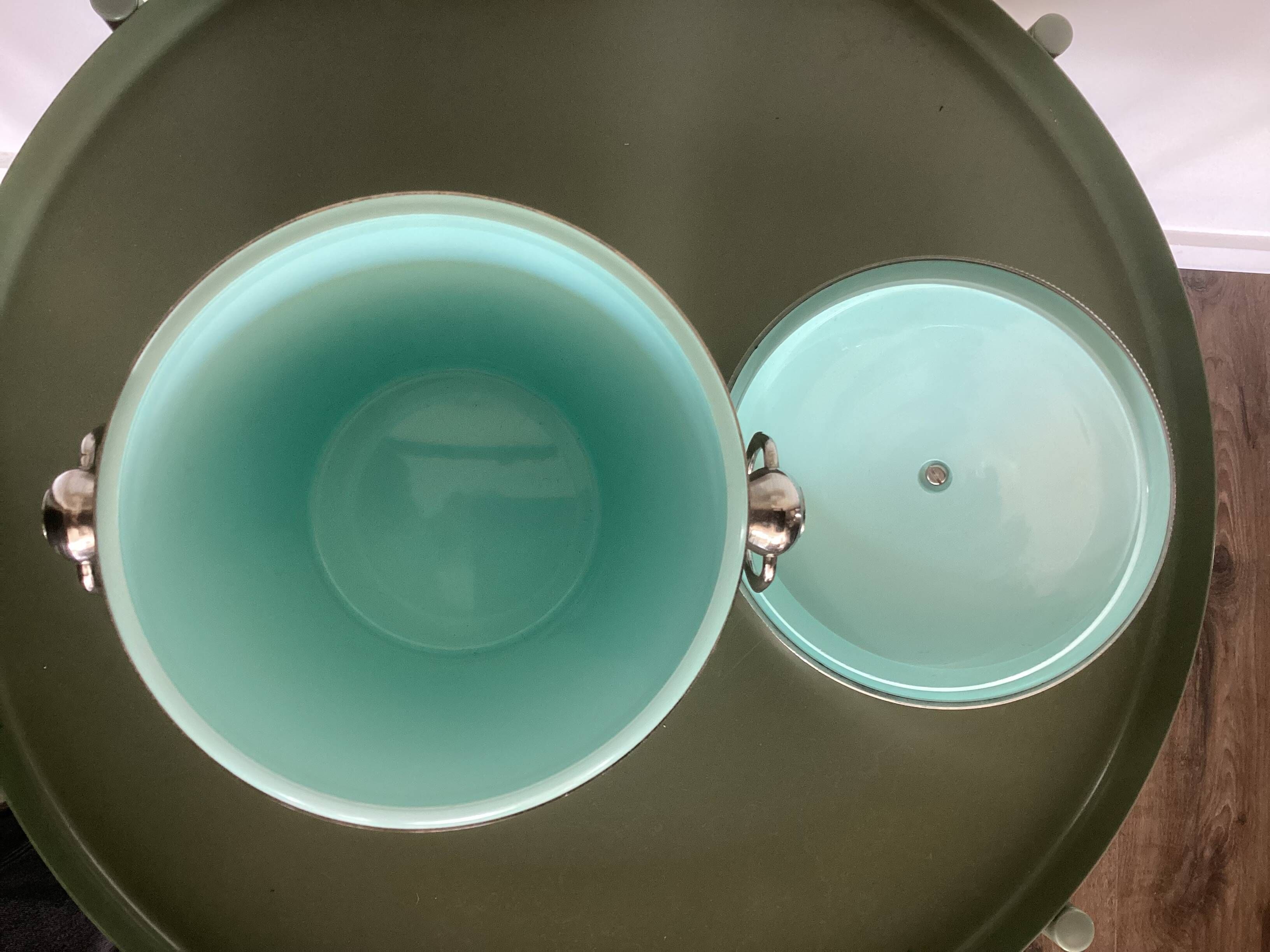 Vintage silver-plated ice bucket with lid and handles.