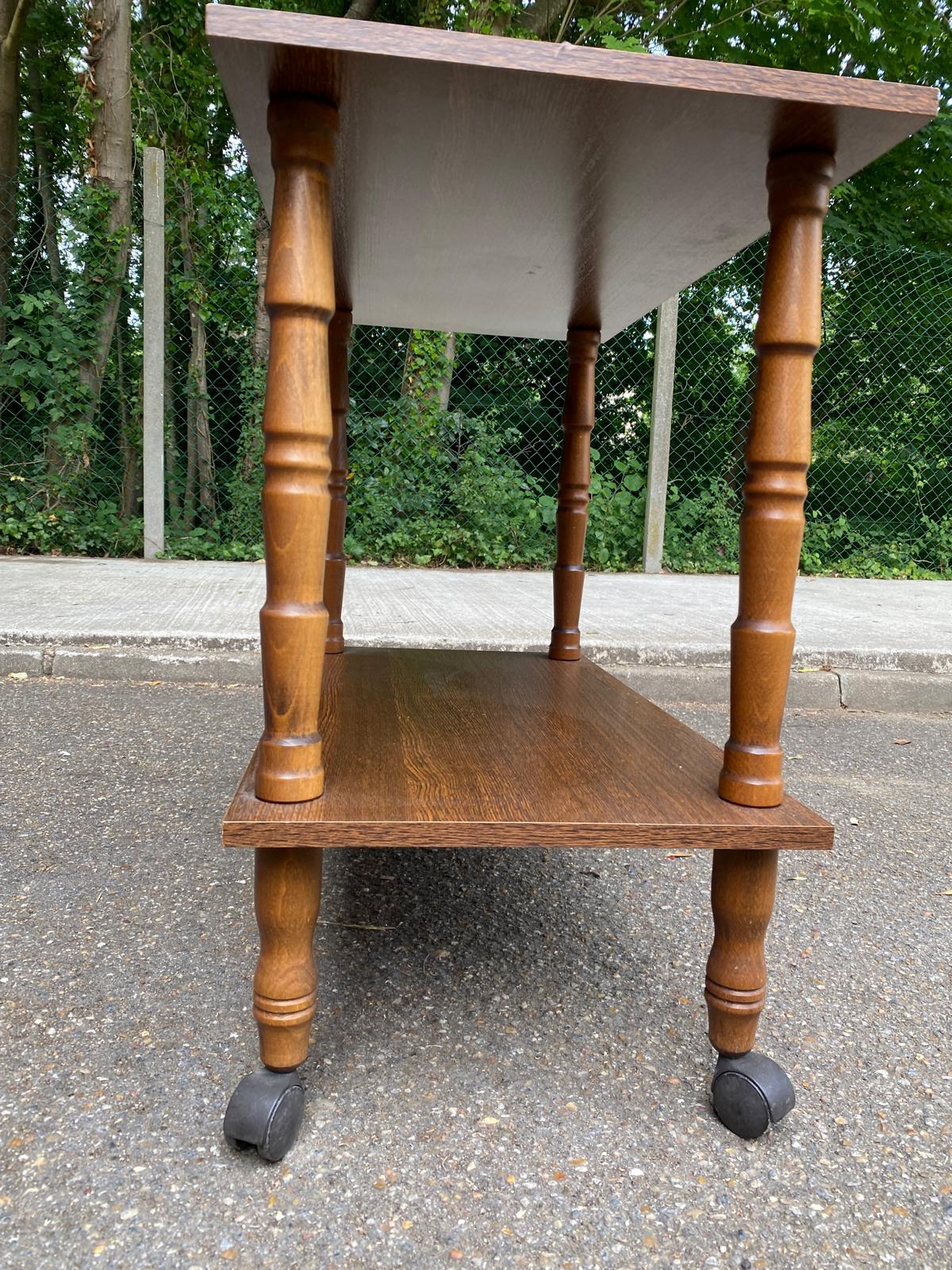 Vintage wooden rolling dessert trolley from the 1980s.
