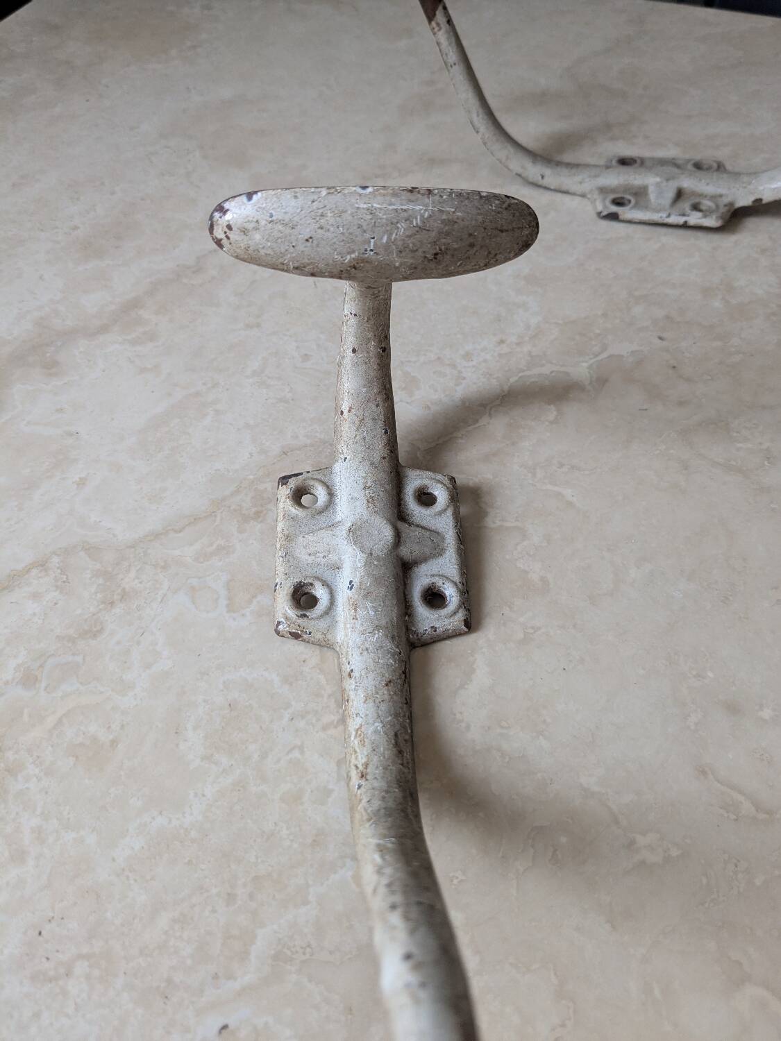 Two vintage coat hooks