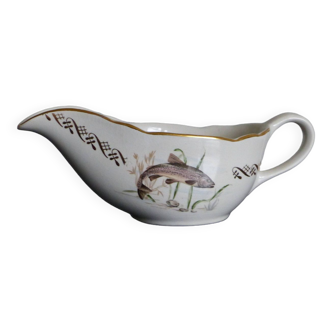 Earthenware gravy boat with fish decoration.