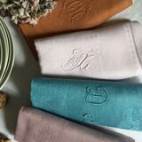 Set of four old damask towels tinted in multiple colors