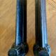 Pair of antique fire dogs with lion heads - patinated cast iron