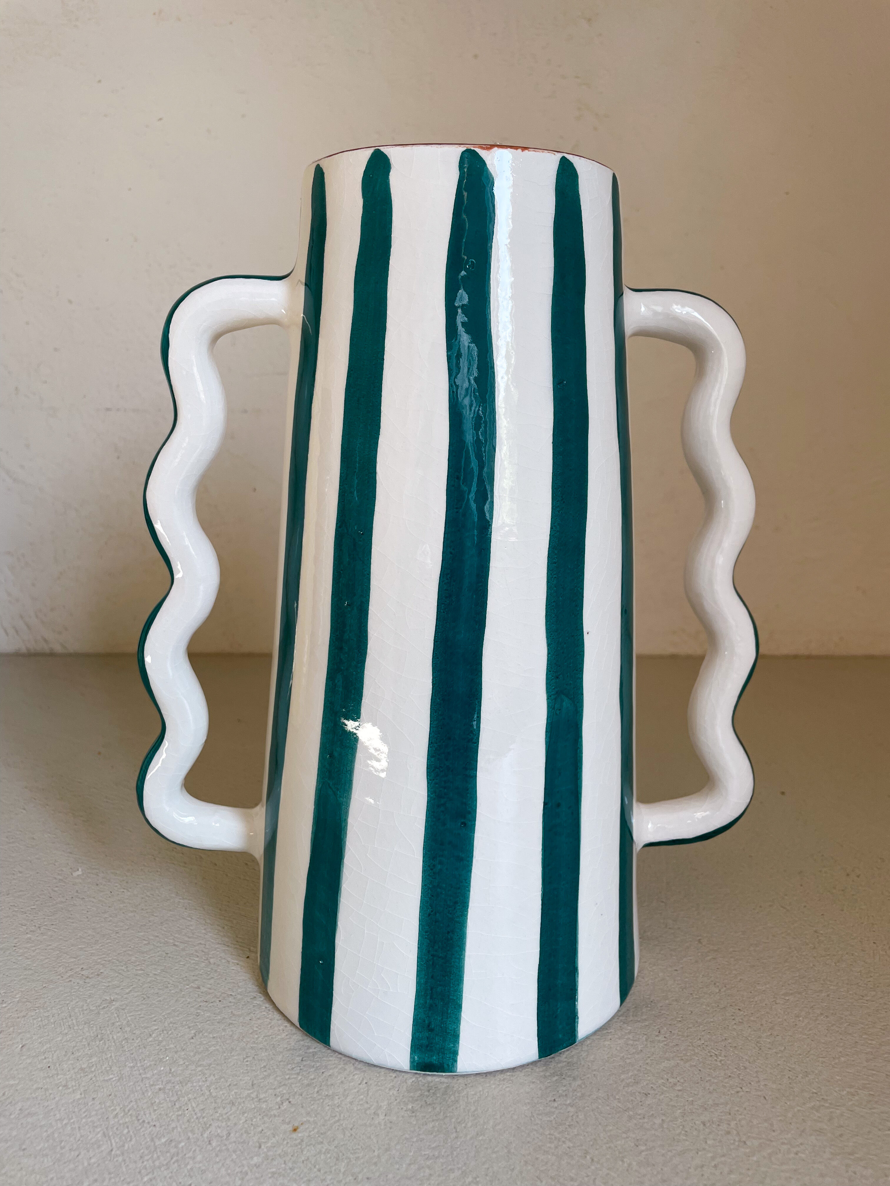 Fir and white green striped ceramic vase with handmade abstract wavy handles