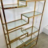 Old shelf in golden metal brass geometric library design 80s vintage