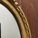 Oval wall mirror in baroque gilded plaster frame 29x20cm