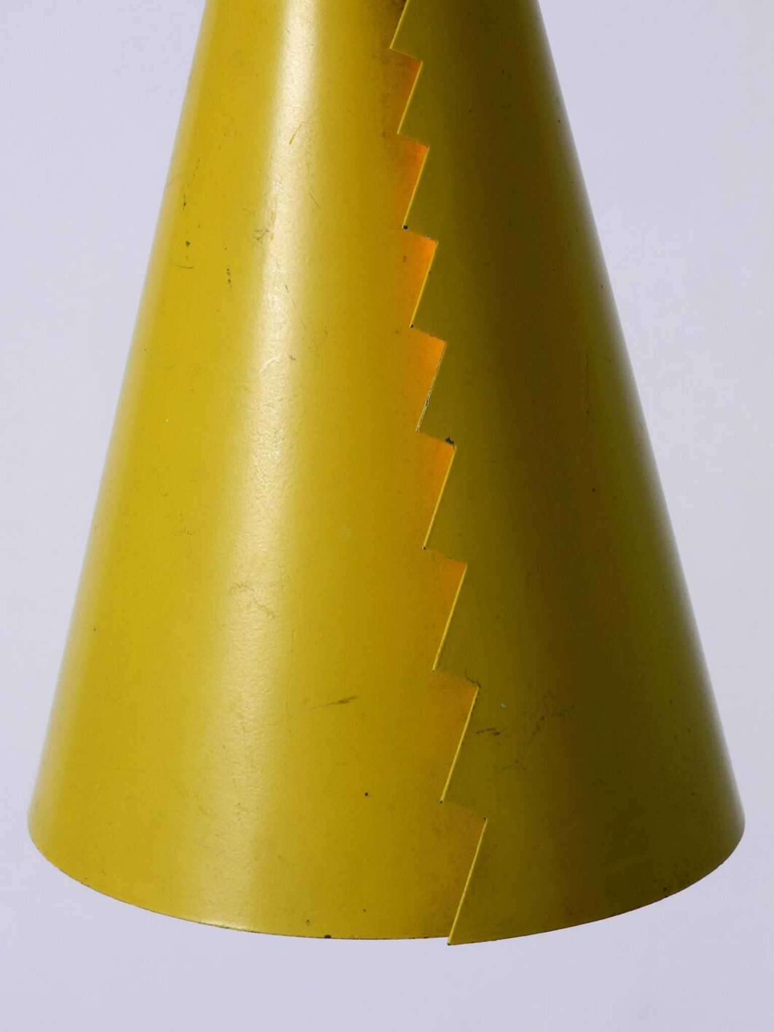Rare Mid Century Modern cone shaped pendant lamp made of sheet steel in yel
