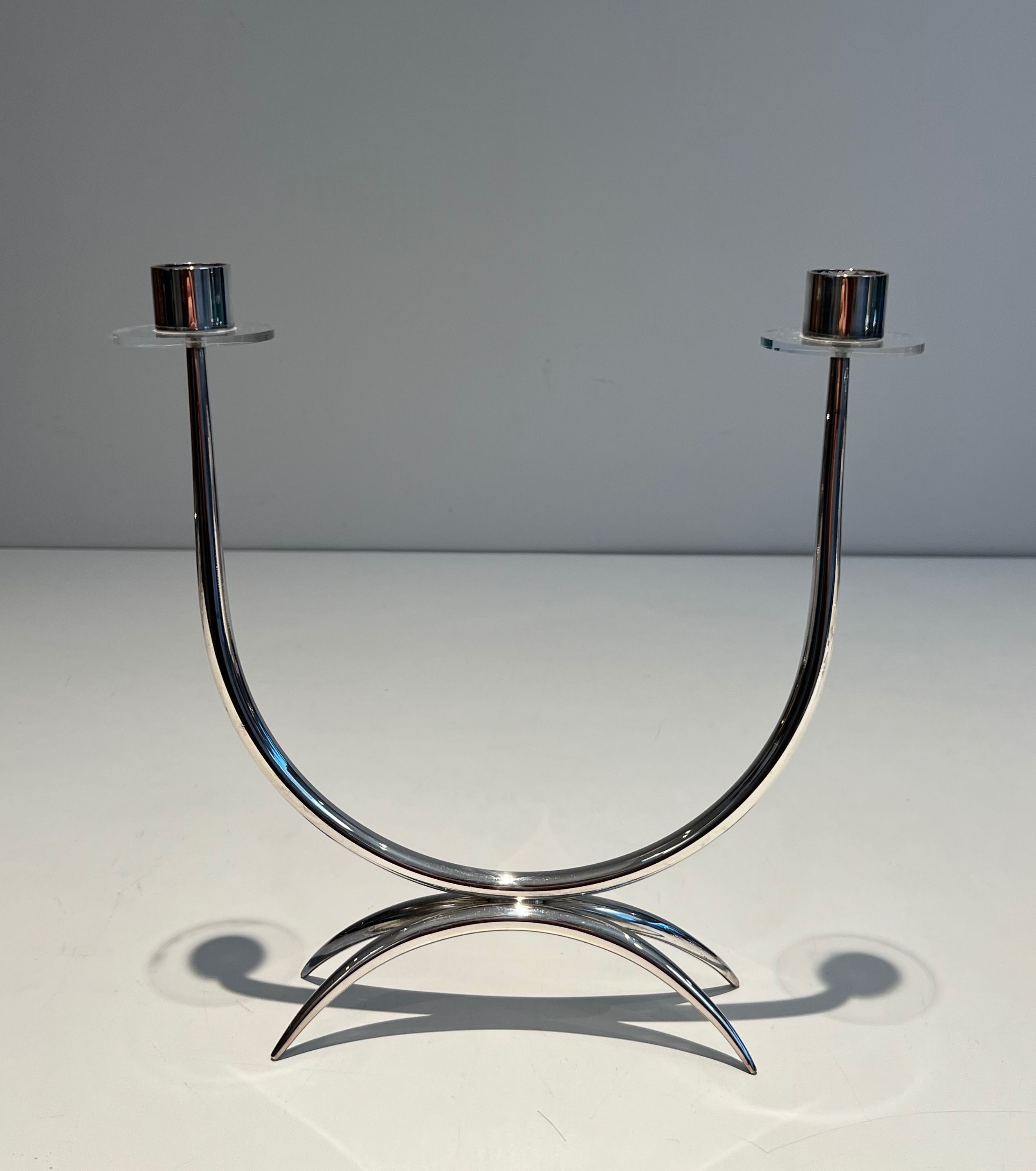 Silver-plated metal and plexiglass design candlestick.