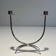 Silver-plated metal and plexiglass design candlestick.
