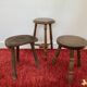 Old wooden tripod stool with ball feet
