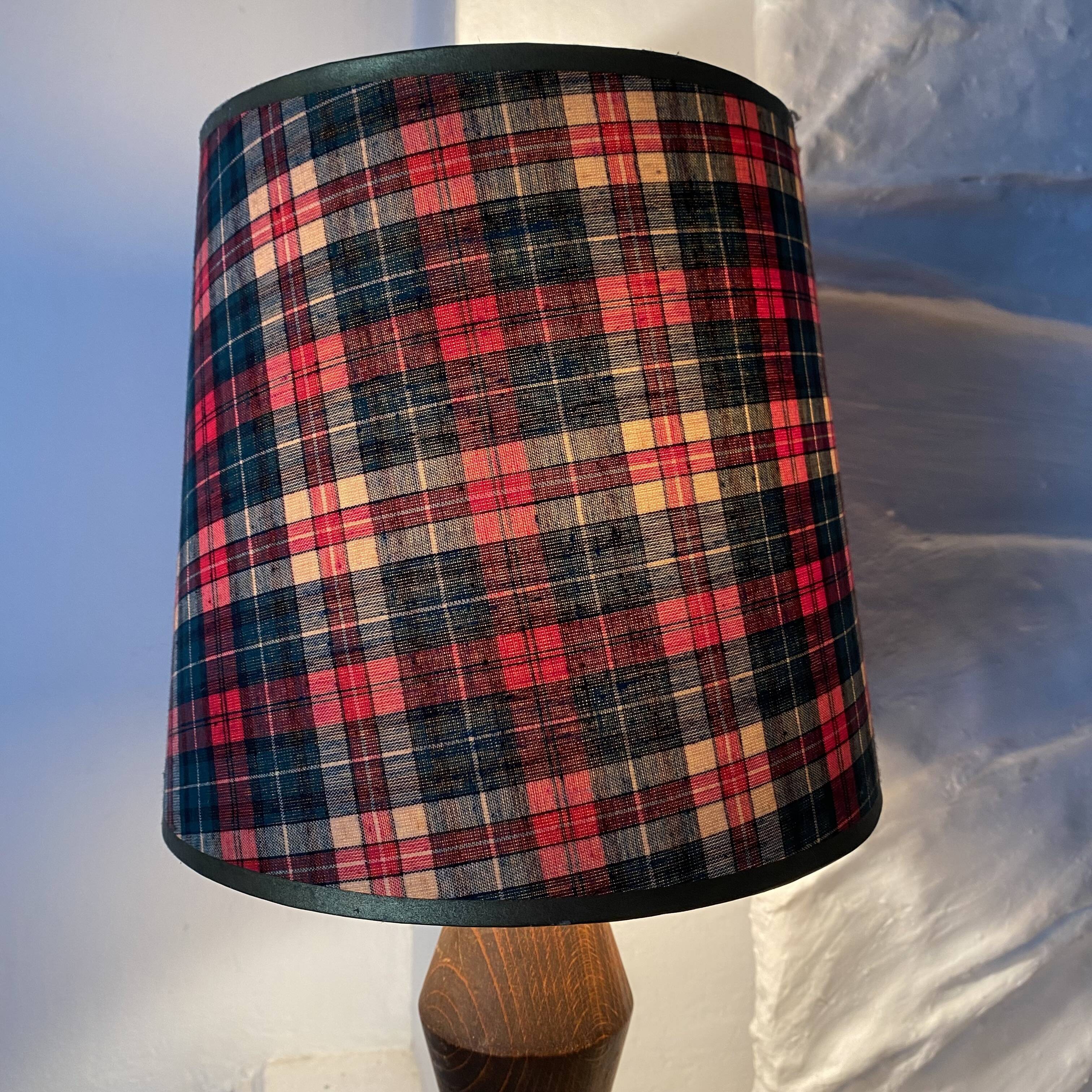 Turned wooden lamp, tartan lampshade.