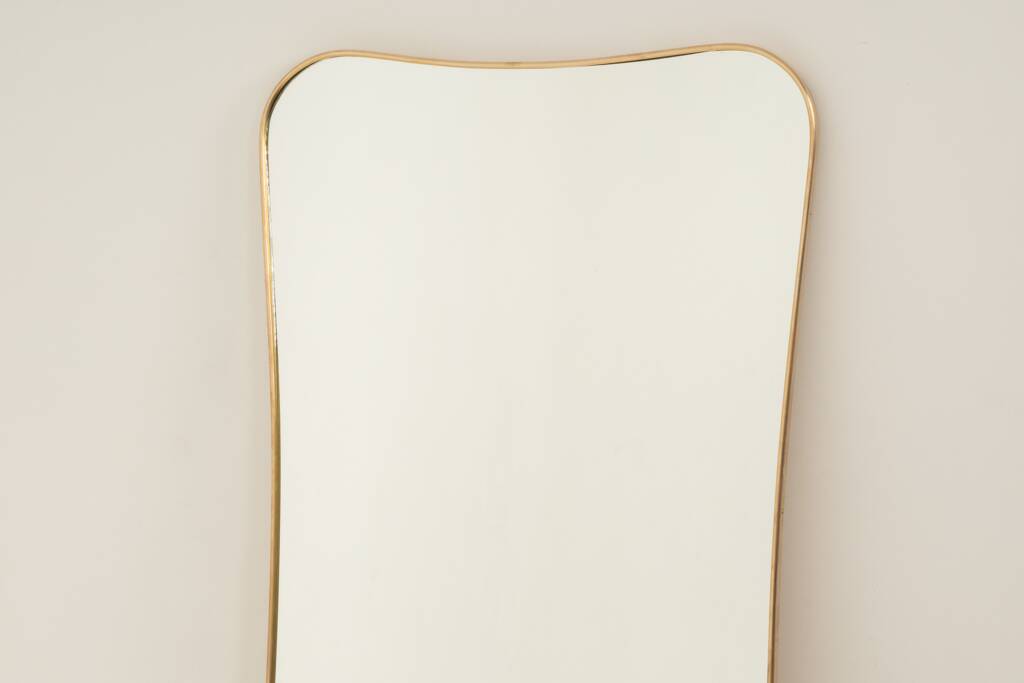 Golden brass mirror in the style of Gio Ponti. 1980s or 1990s.