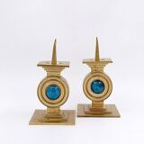 Pair of brass candlesticks decorated with a blue stone inlaid in the center