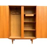 Rattan wardrobe and its compass-legged chest of drawers, 1960