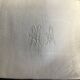 Damask napkins embroidered with an MA monogram