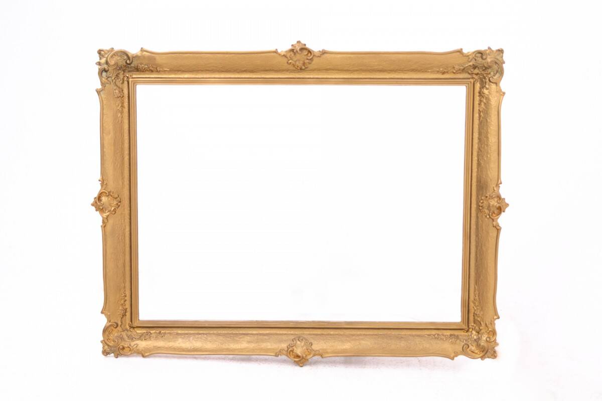 Horizontal mirror in gold frame, France.