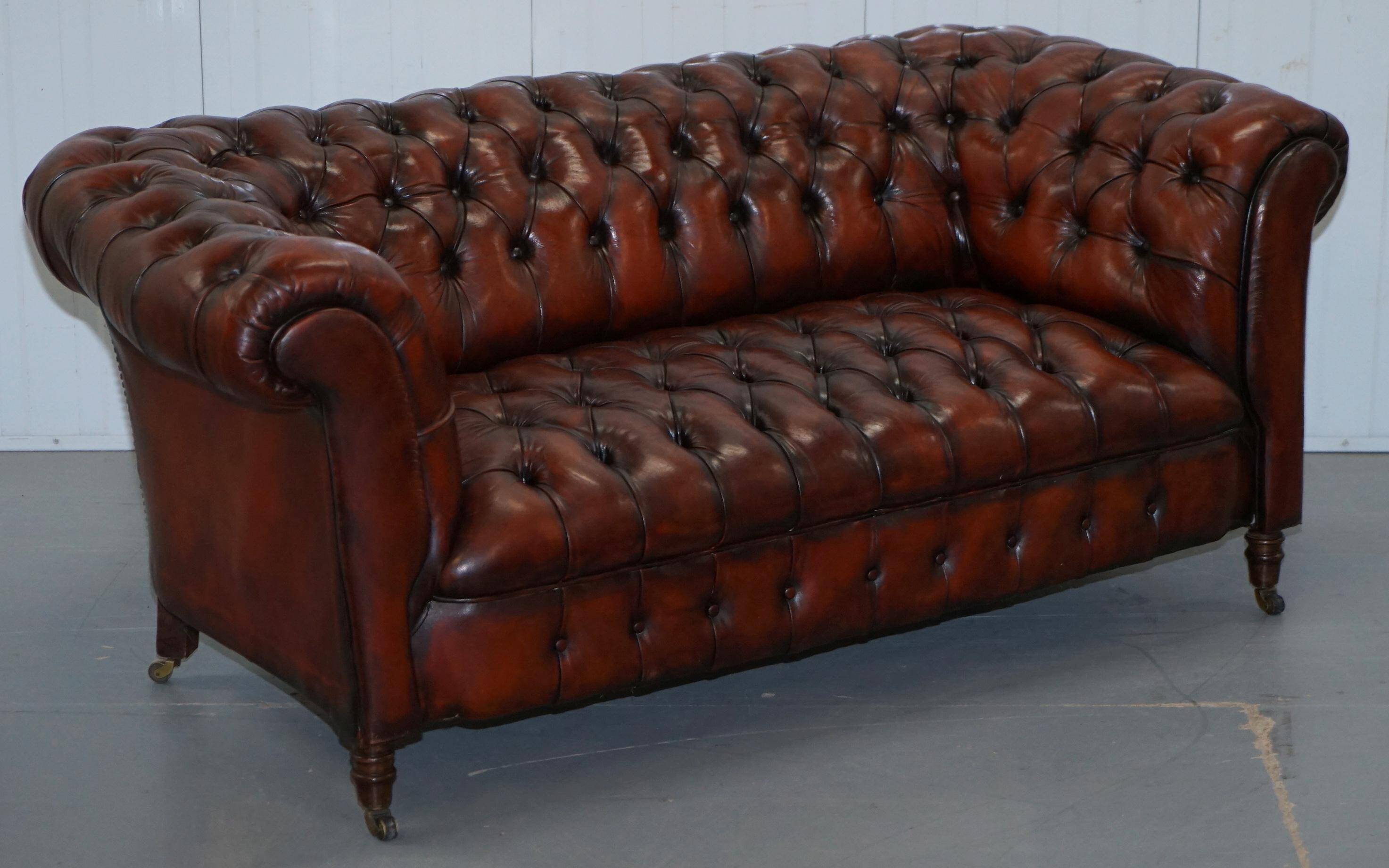 Small Victorian leather Chesterfield sofa