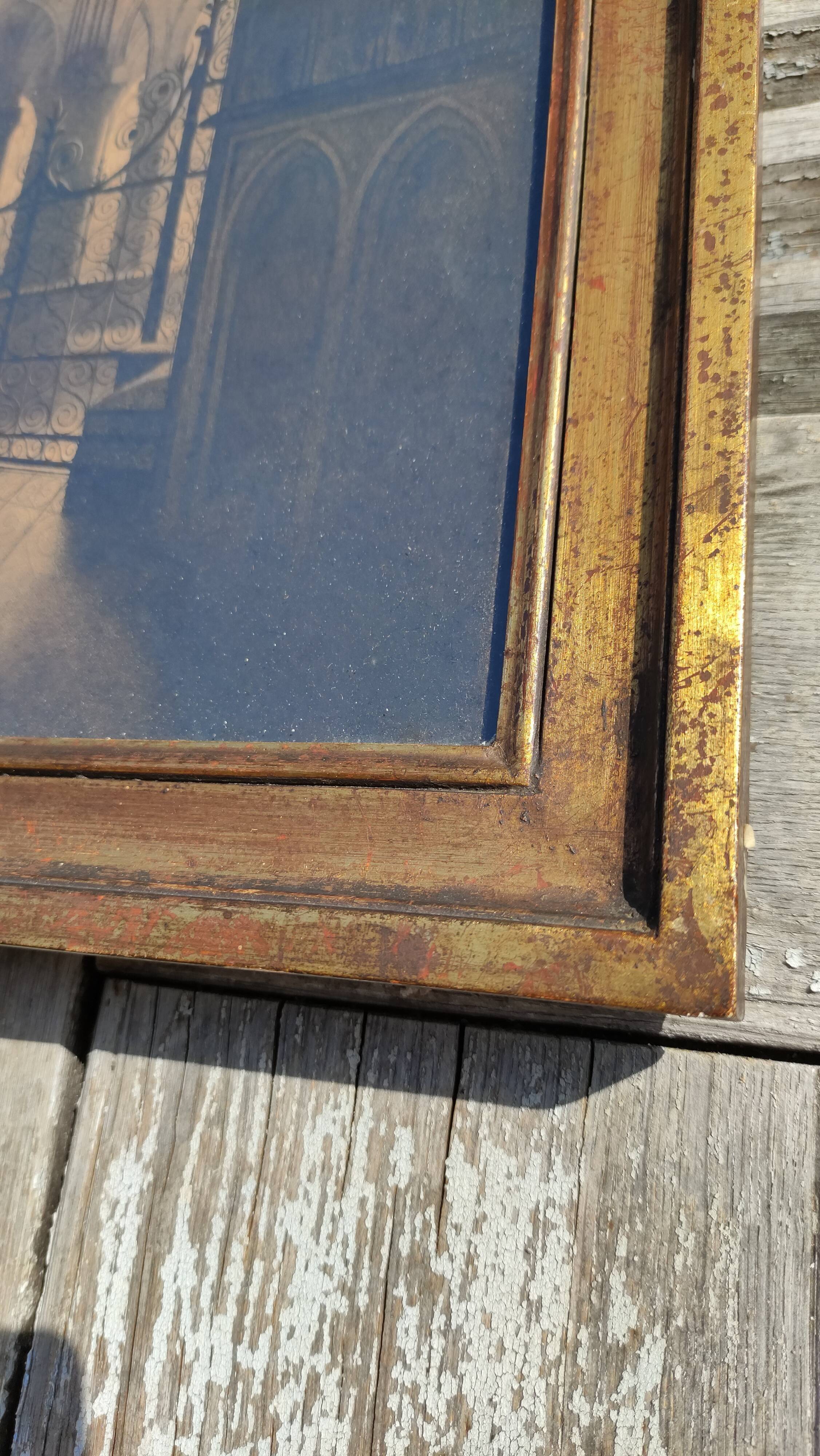 Large old wall frame in gilded wood