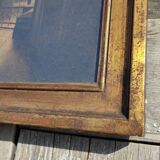 Large old wall frame in gilded wood