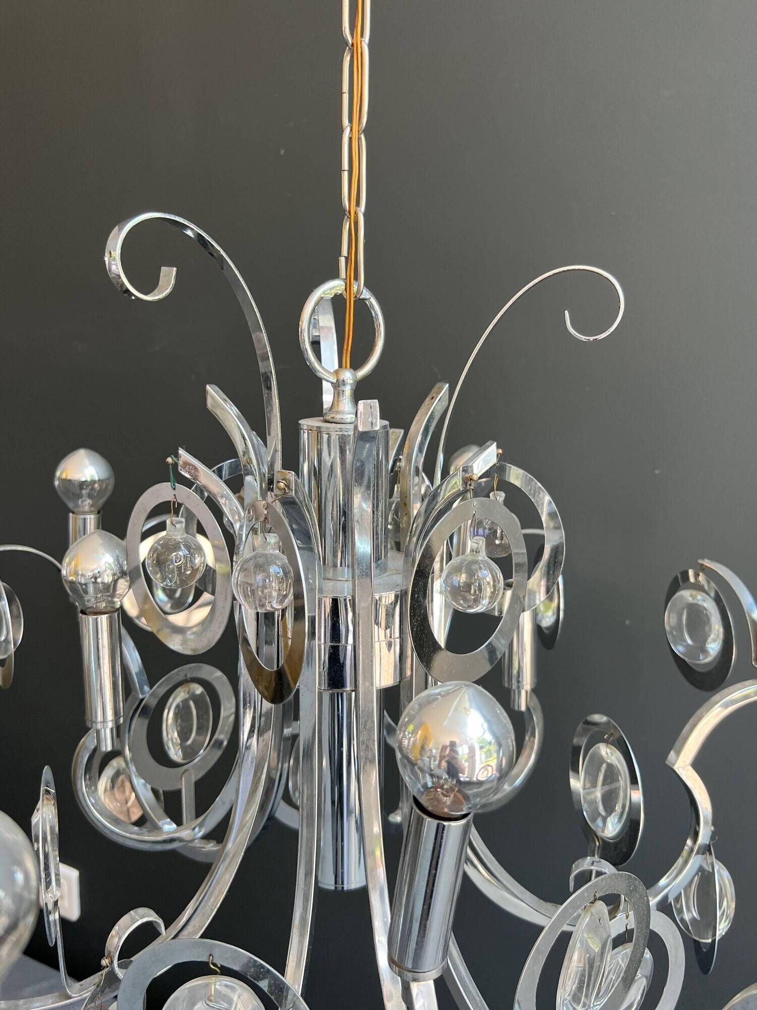 Chrome Metal Design with Swirls and Optical Glass Lenses. Tra