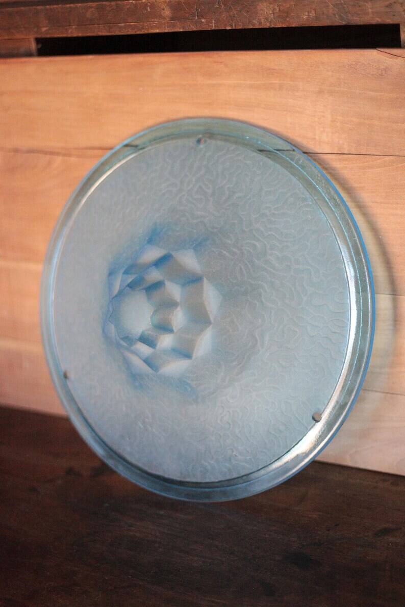 Vintage Art Deco ceiling light, suspension bowl with geometric patterns, blue dish, interior decor.