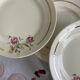 6 antique Badonviller faience dessert plates with flowers and gilding.